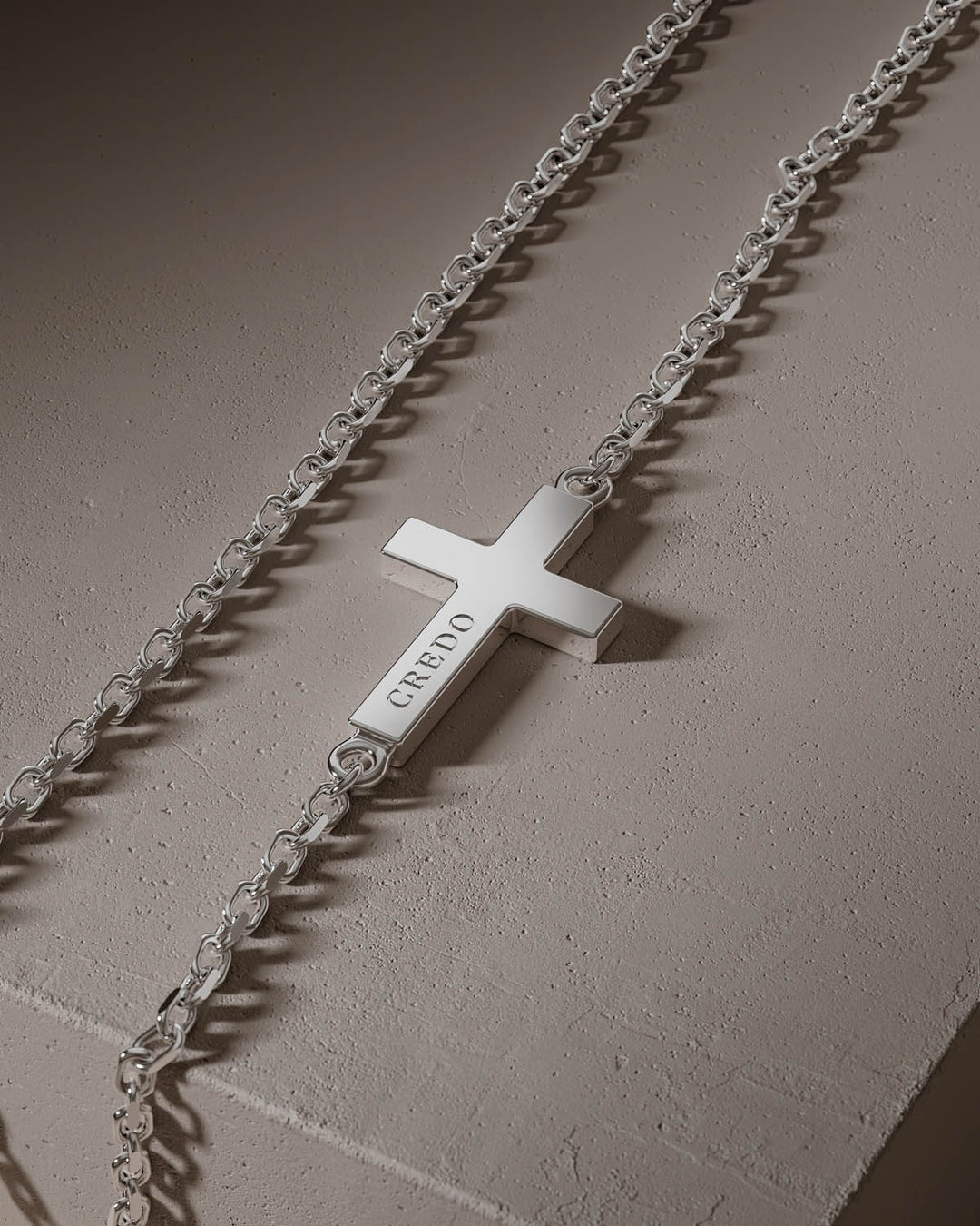 Silver side cross with CREDO engraving, close-up
