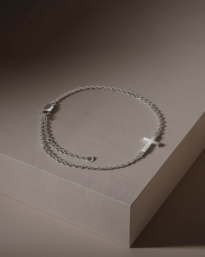 Side cross bracelet in silver with adjustable chain, full view