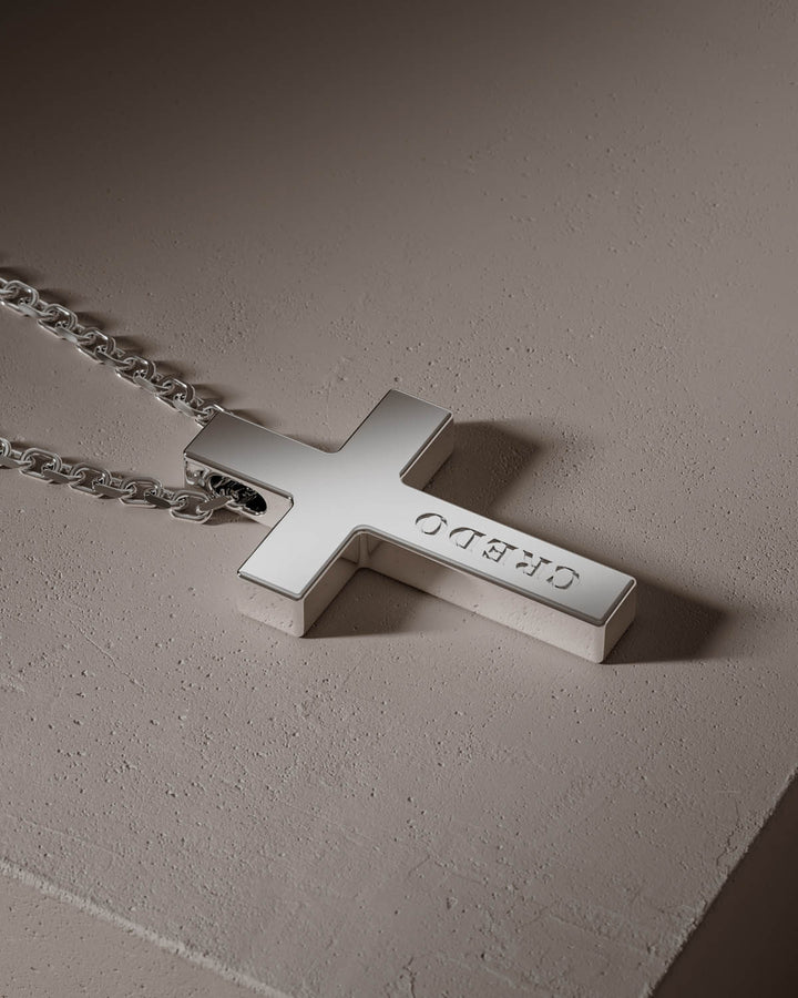 Silver cross pendant with CREDO engraving, close-up