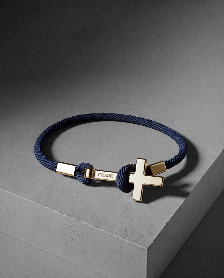 Women's Rope Cross Bracelet in navy blue with a gold cross