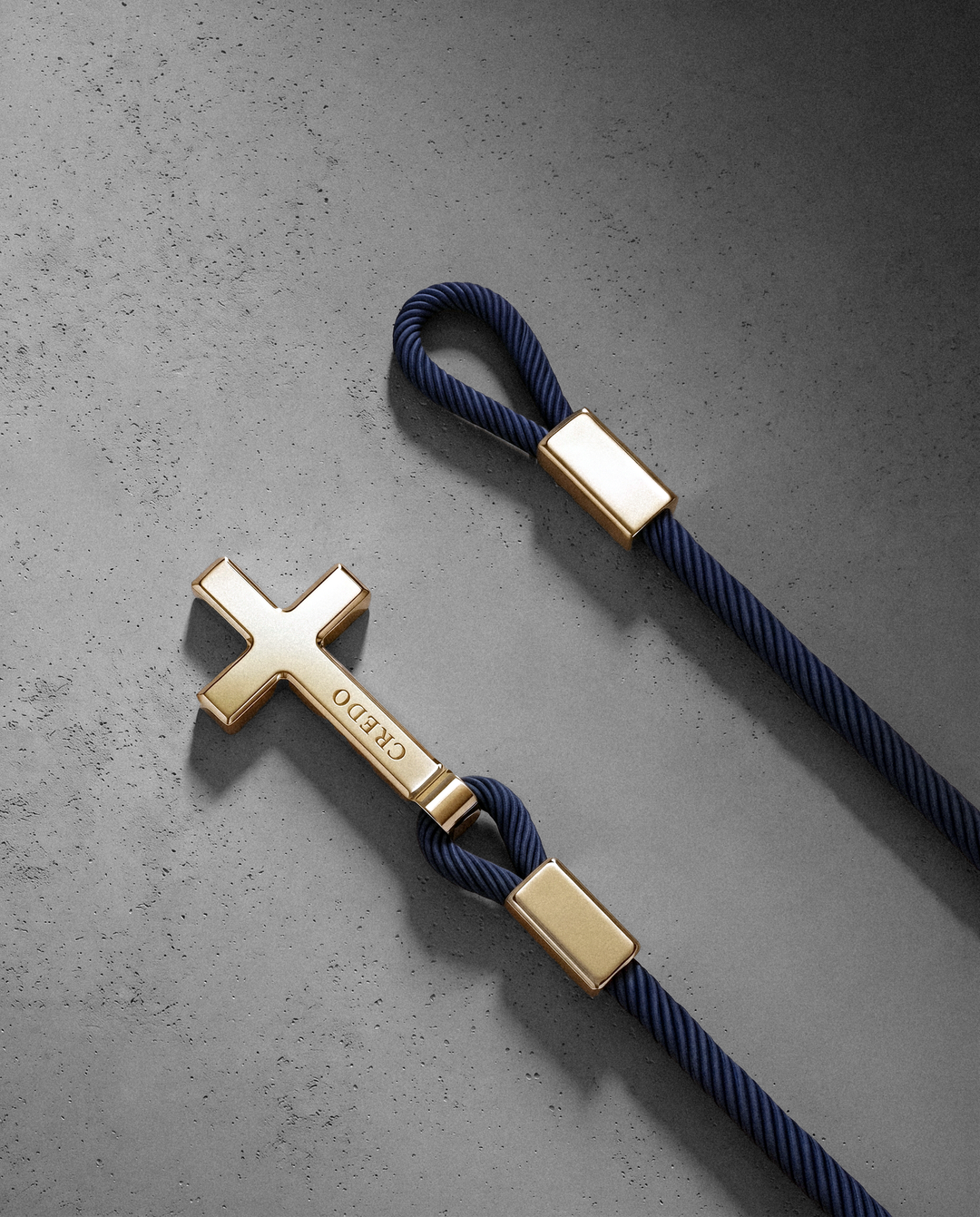 Women's Rope Cross Bracelet in navy blue with a gold cross, second view
