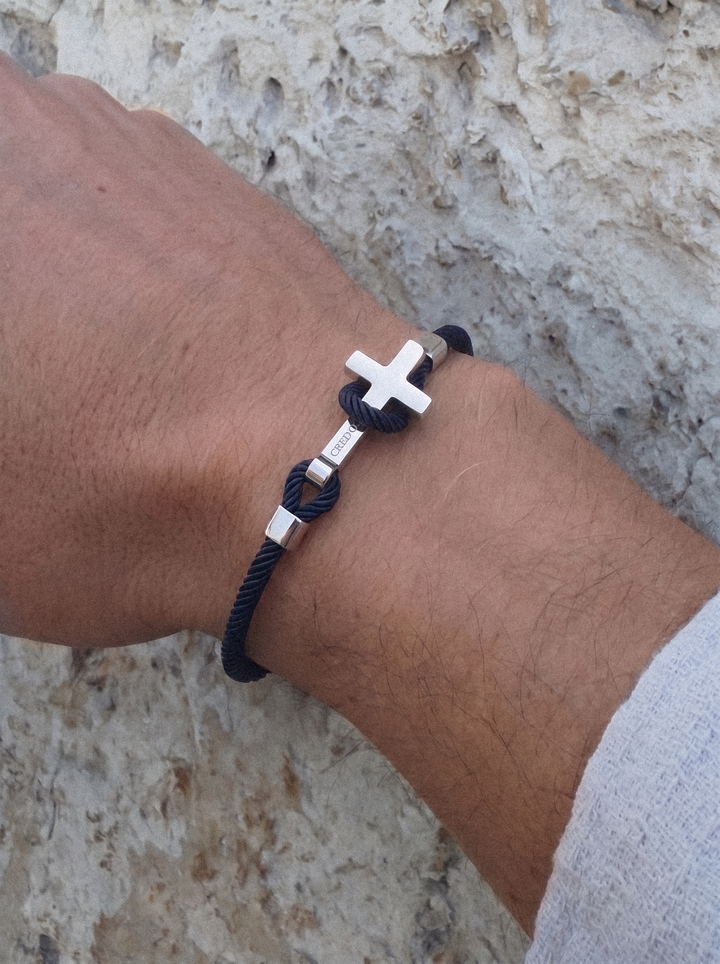 Men's Rope Cross Bracelet in navy blue with a silver cross, lifestyle view